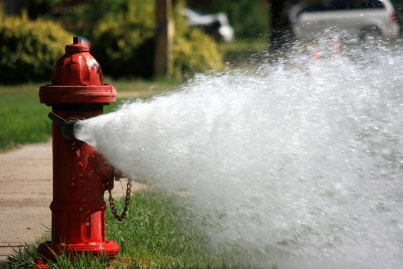 A fire hydrant spraying water.